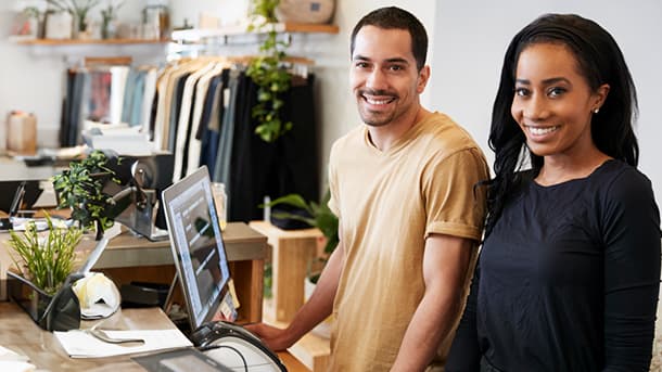 Male and female working in retail store